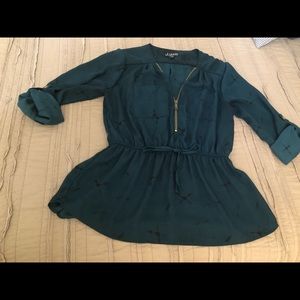 J for Justify. Medium dark green blouse.